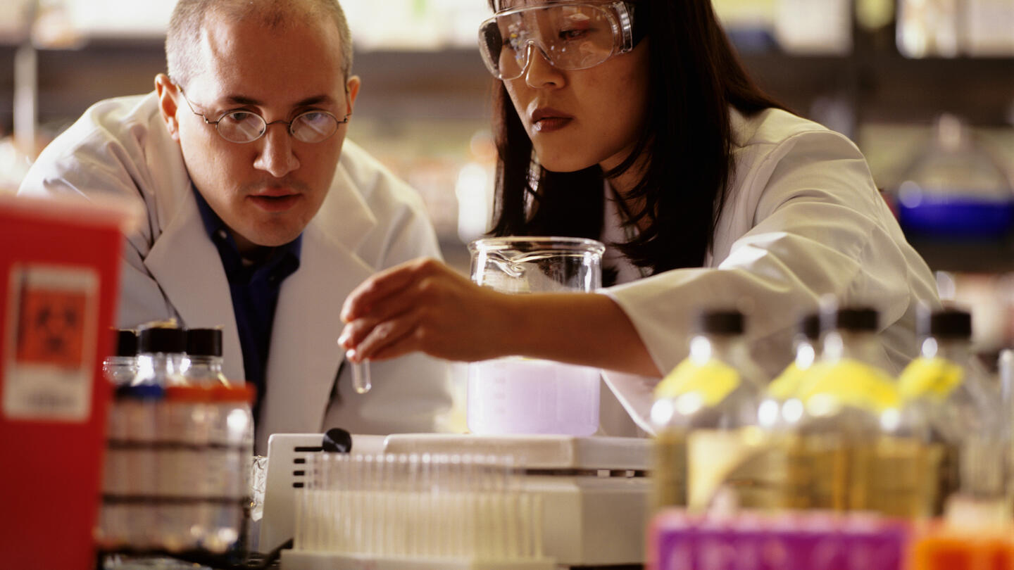 Scientists conducting experiment